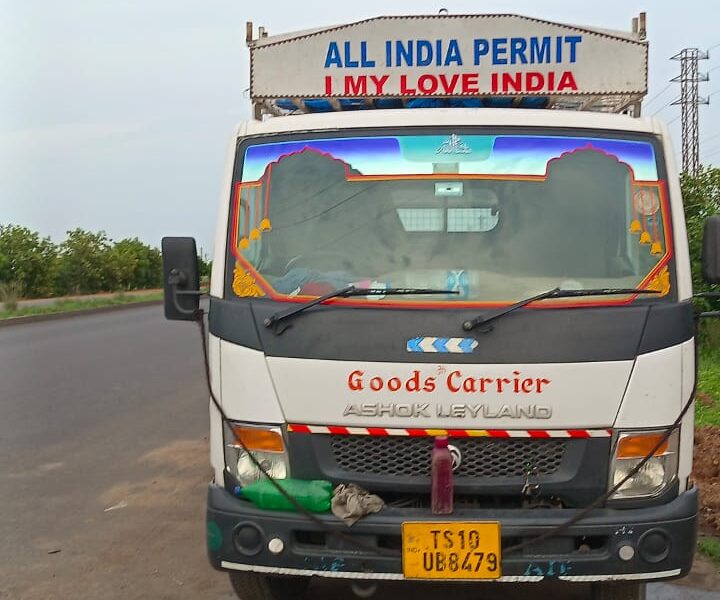 Goods carrier for transportation with driver